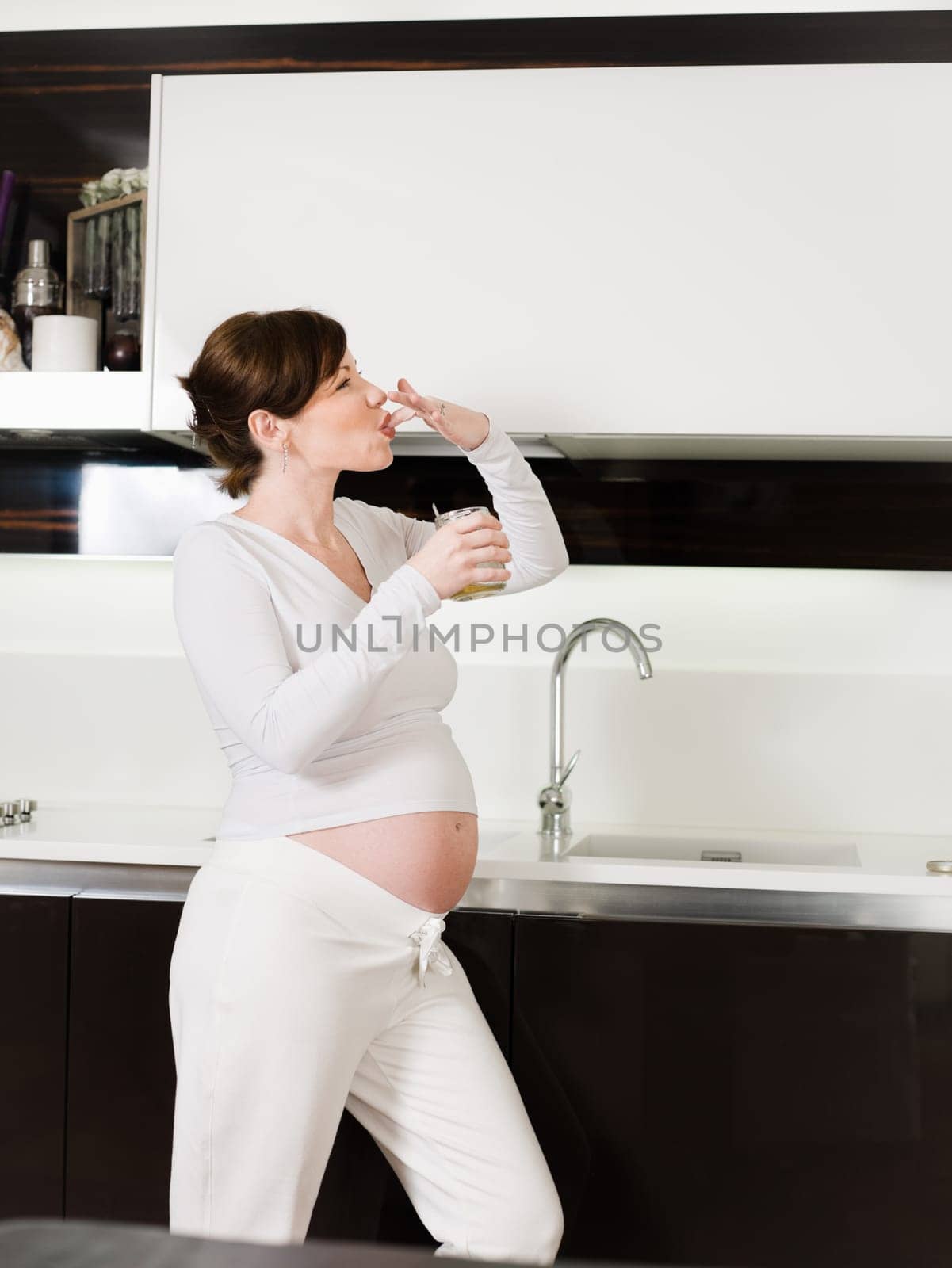 pregnant woman drinking water
