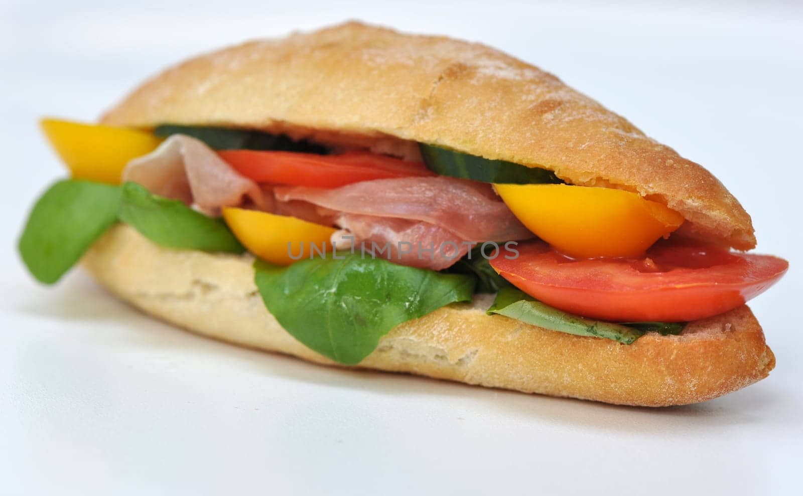 Baguette with raw ham,bell pepper,tomato,basil
