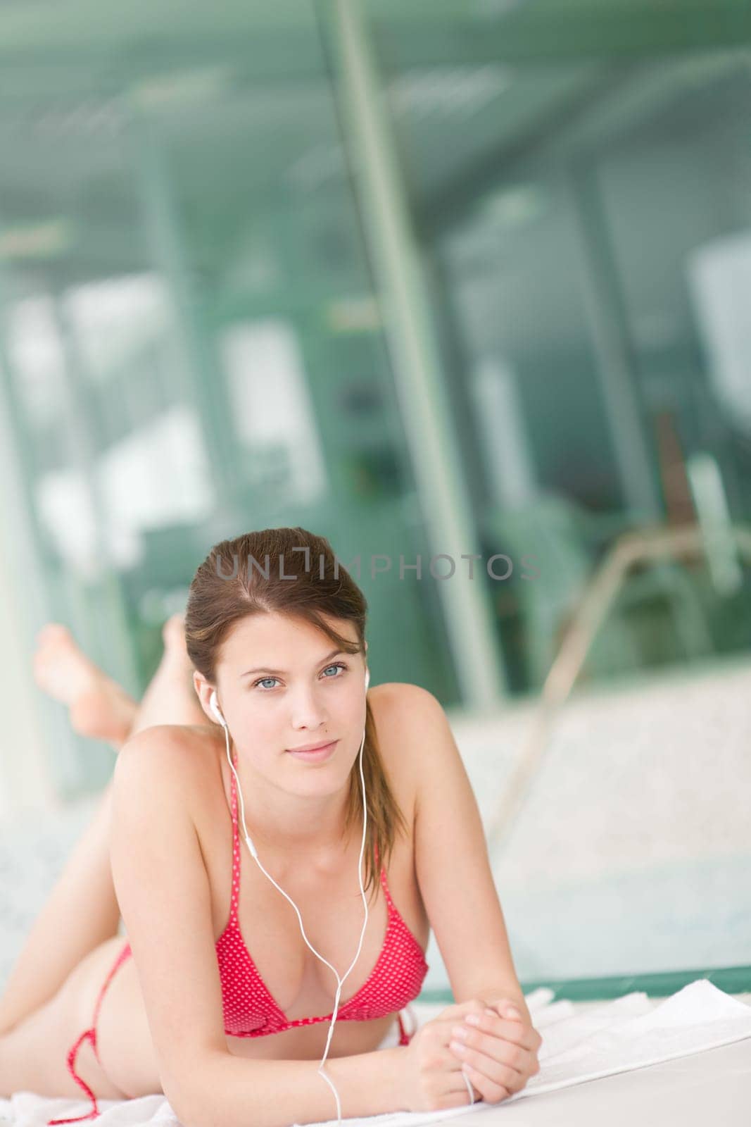 Swimming pool - woman relax listen to music