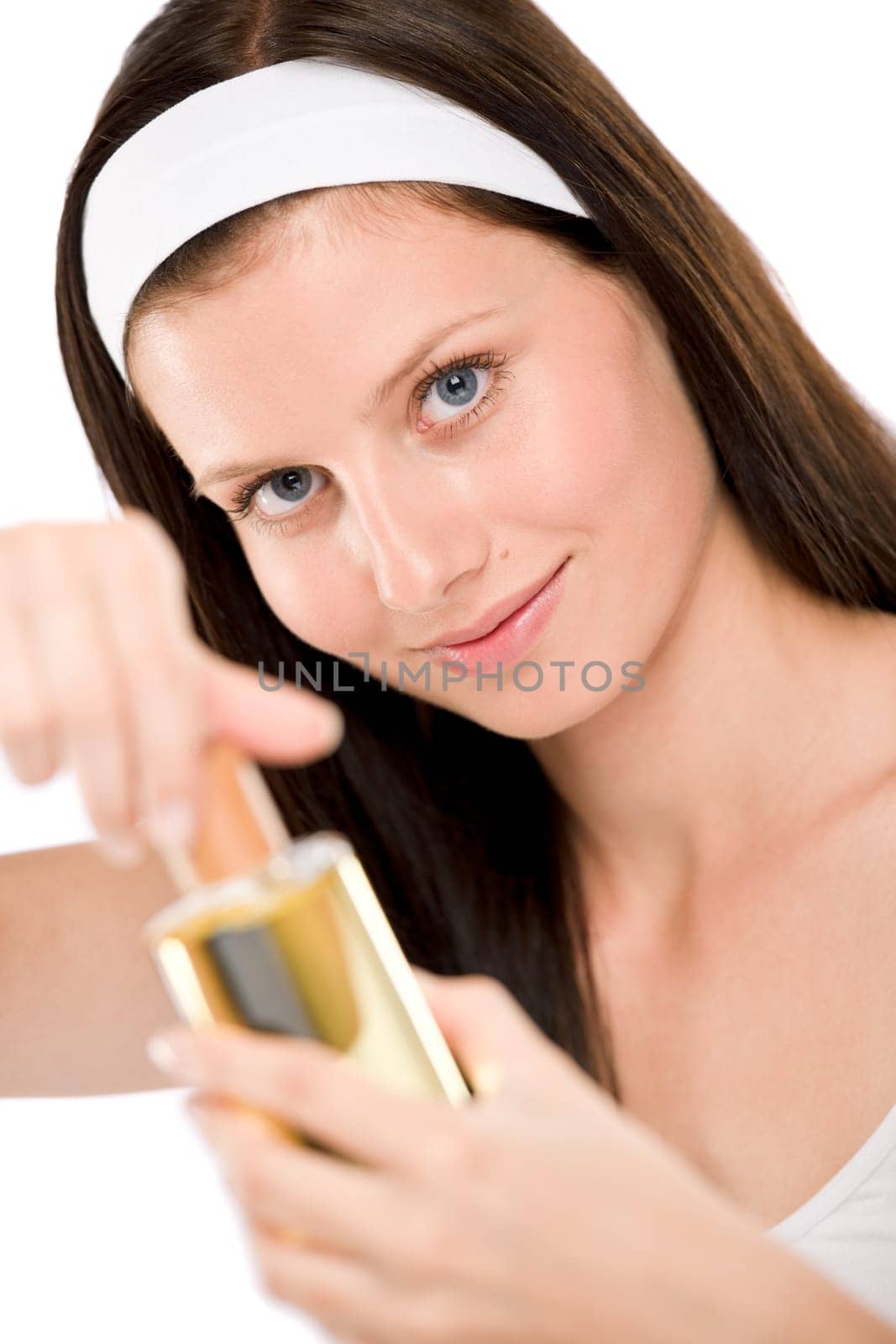 Beautiful woman holding perfume
