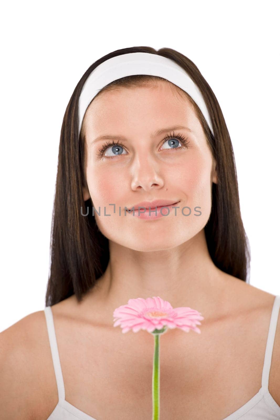 Beautiful woman holding gerbera daisy flower