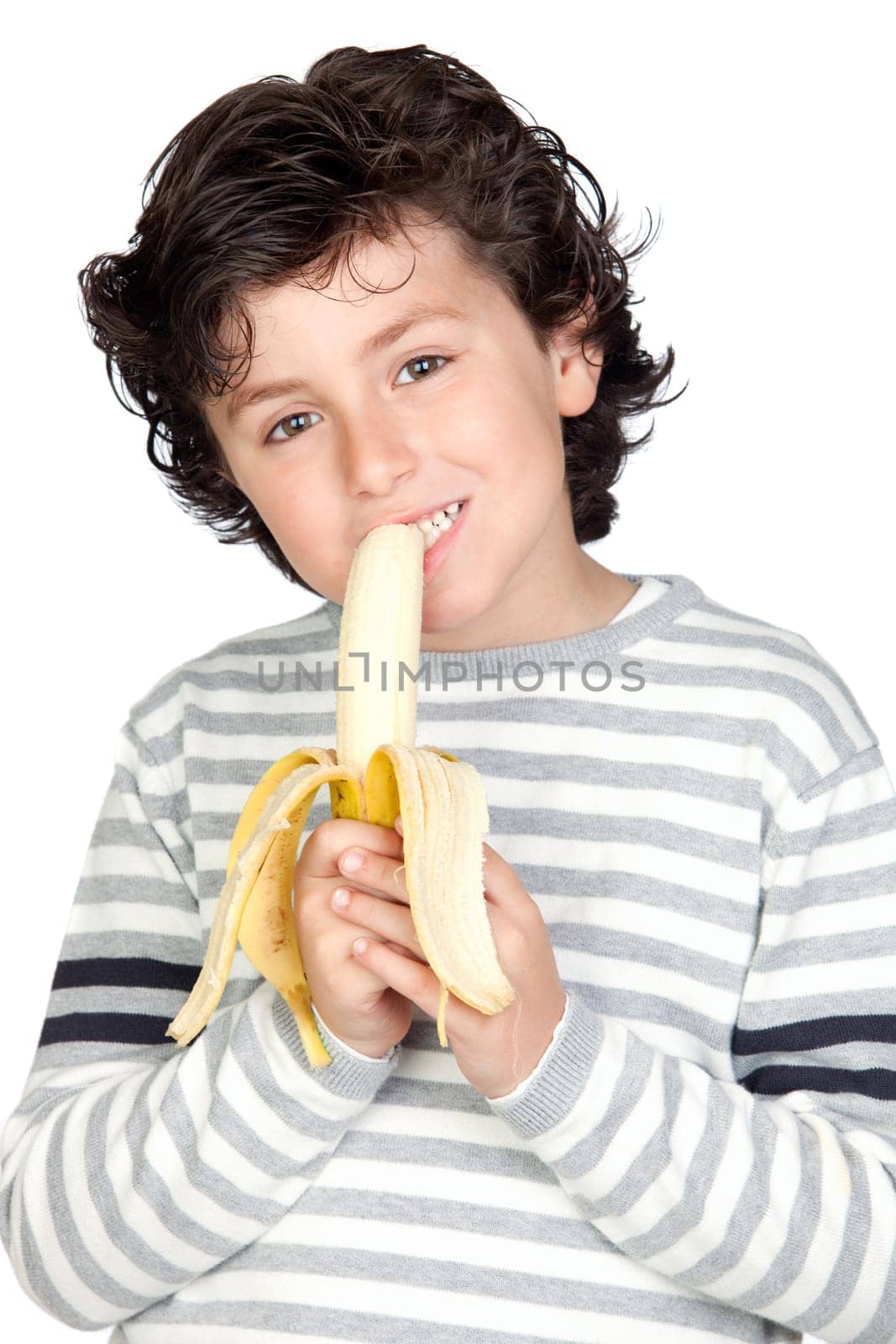 Beautiful child eating a banana