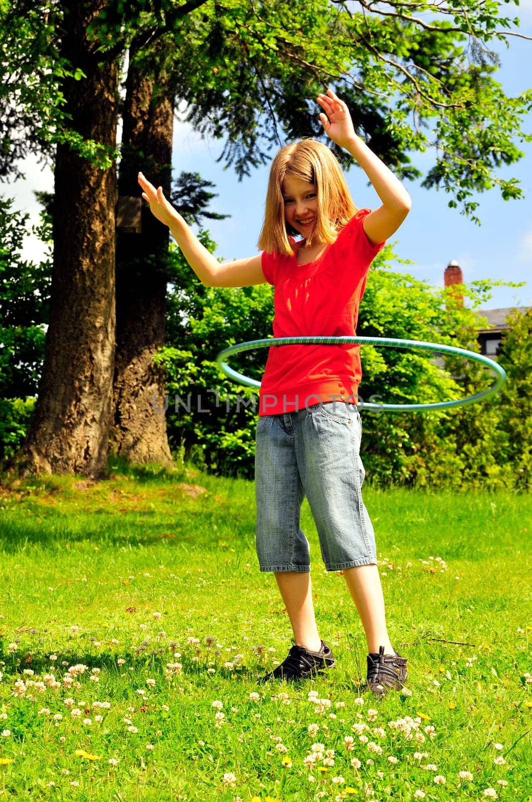 Child in the garden hopping jumping
