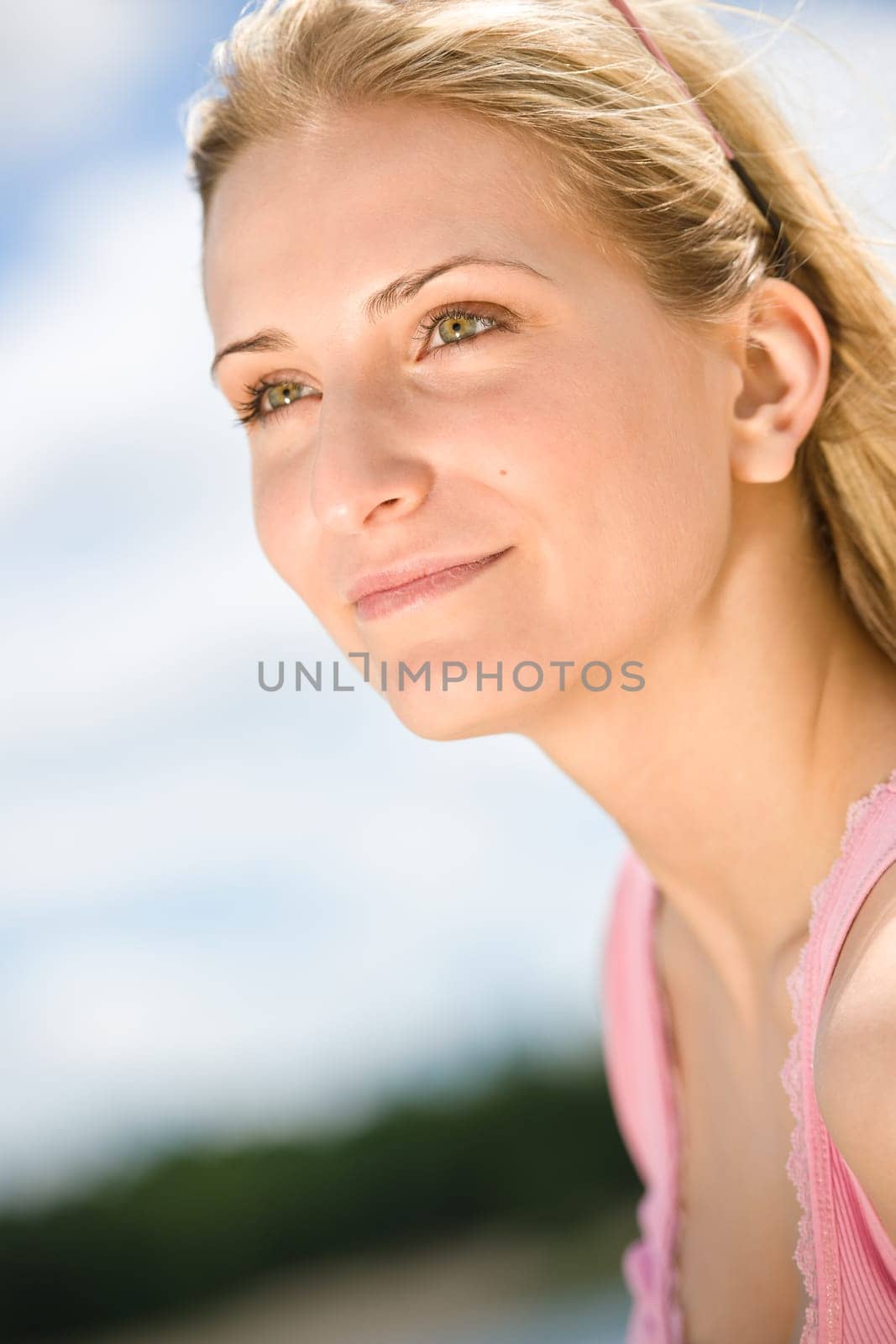 Blond woman enjoy summer sun