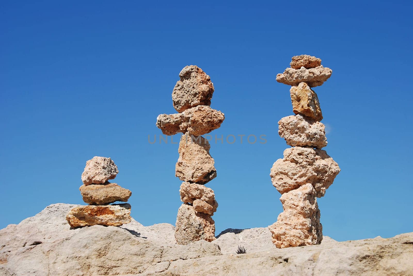 three stacks of stones