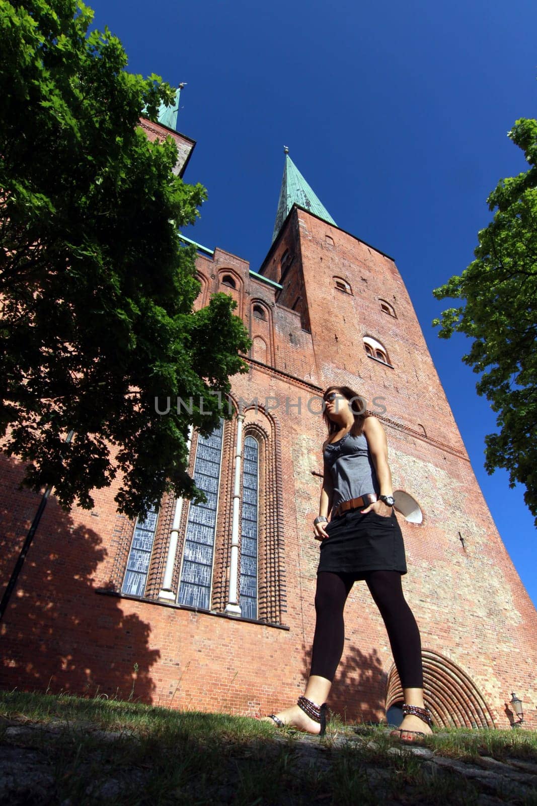 Young woman in front of Lübeck Cathedral