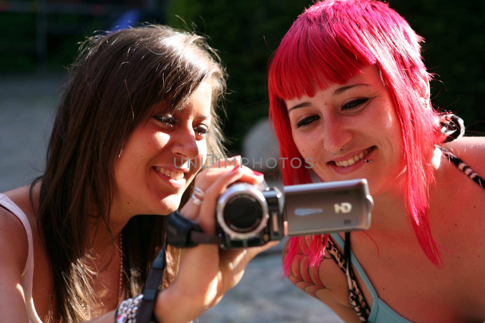 two young women with video camera