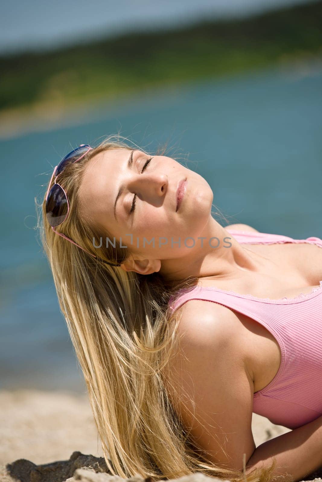 Blond woman enjoy summer sun