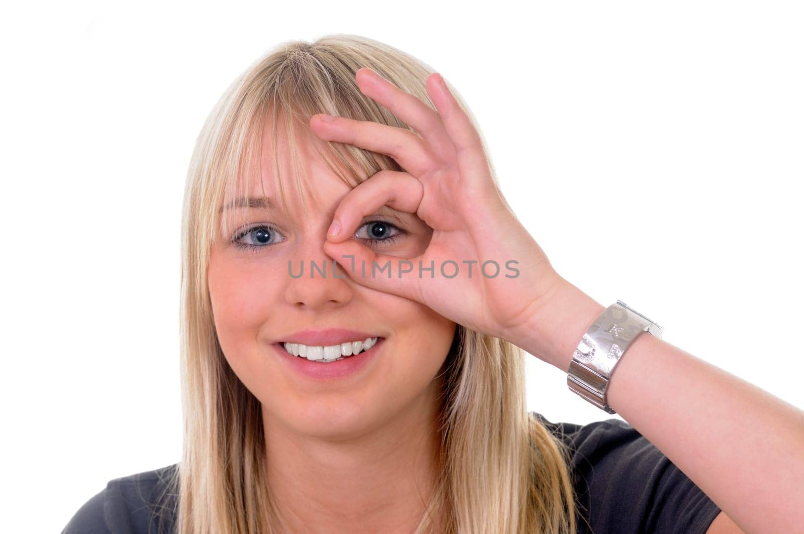 Young woman showing magnifying glass
