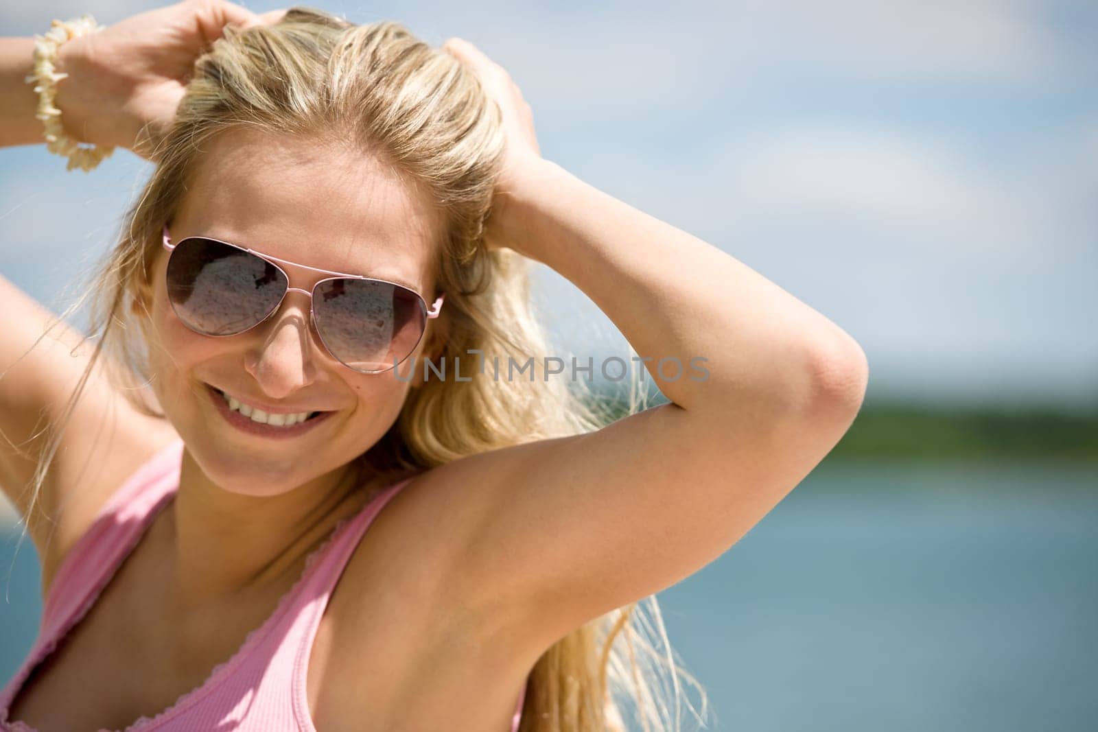 Blond woman with sunglasses enjoy sunny day