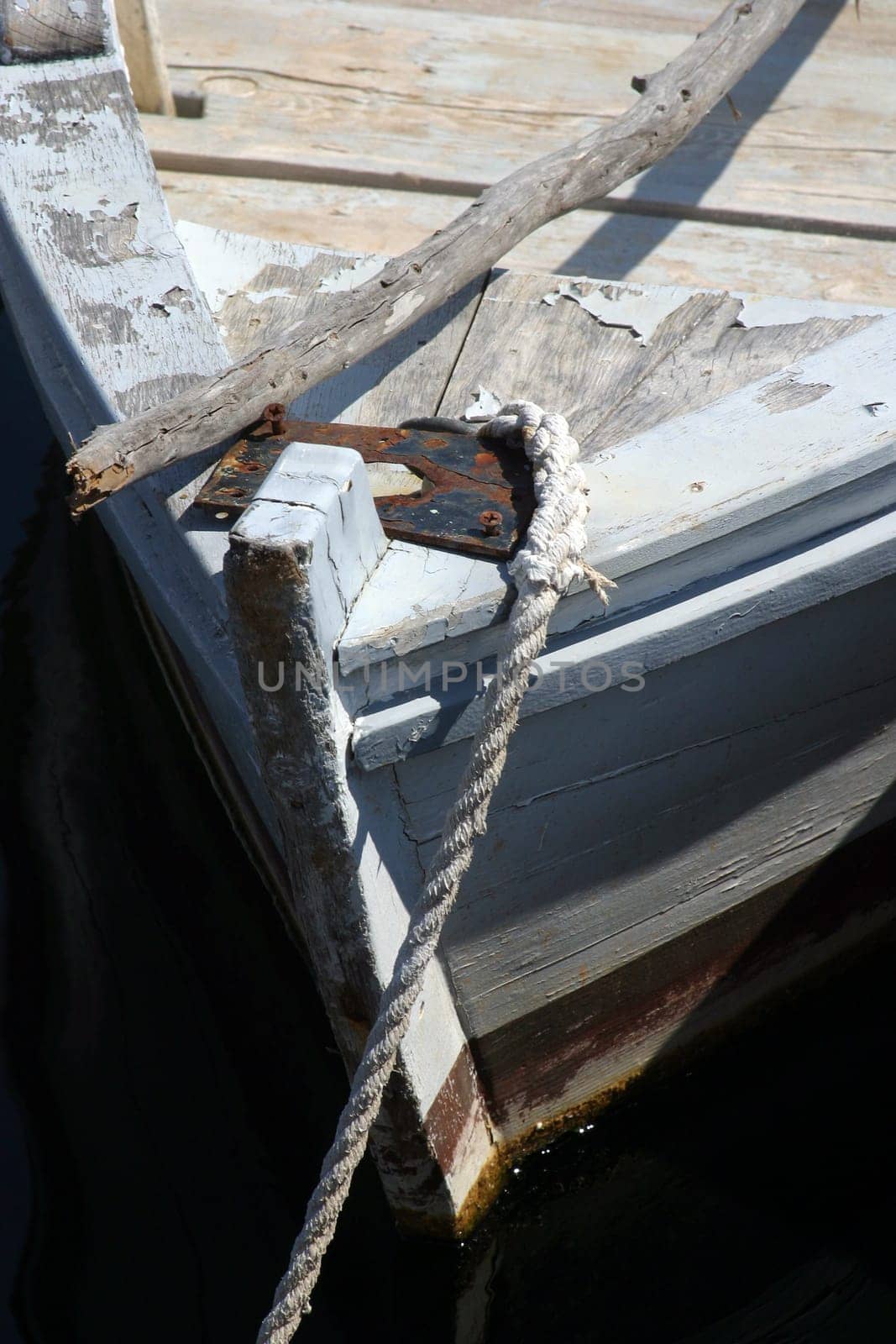 A wooden rowing boat tide down