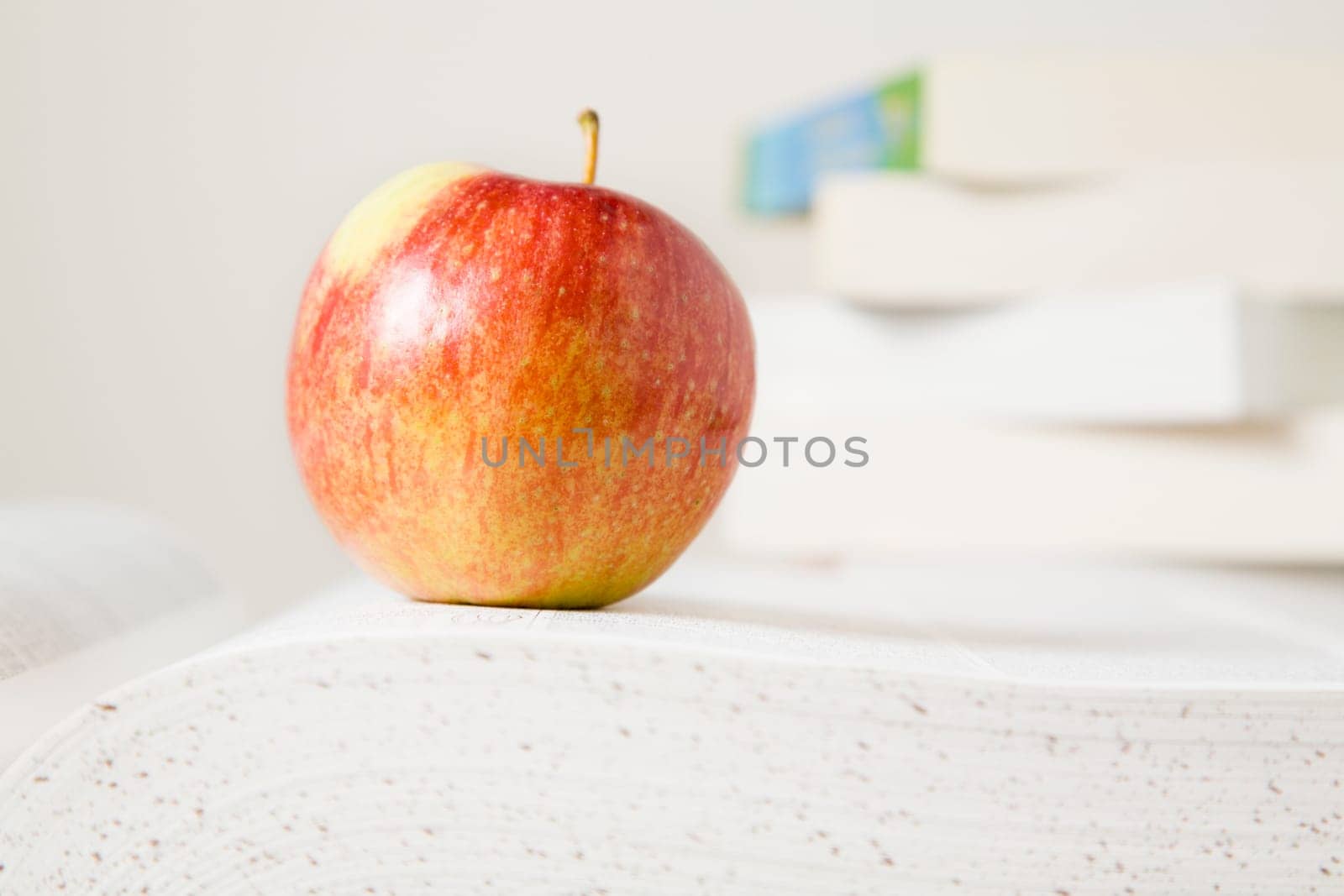 Books and apple