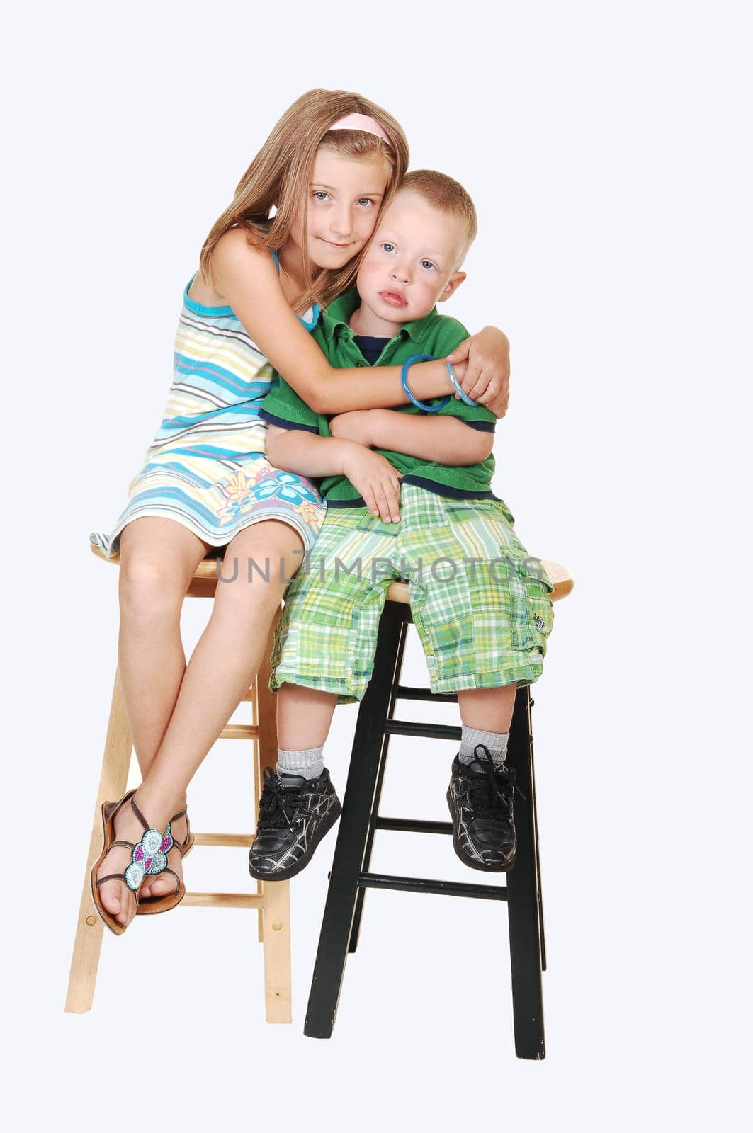Girl giving hug to brother.