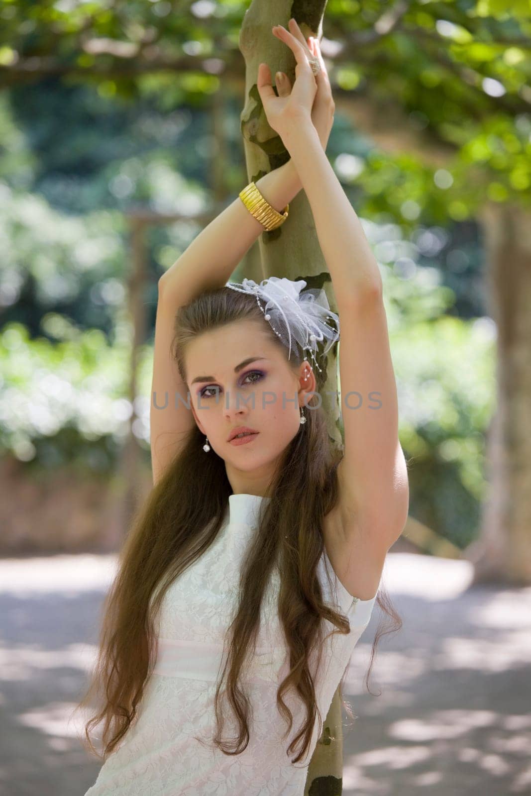 young bride at tree