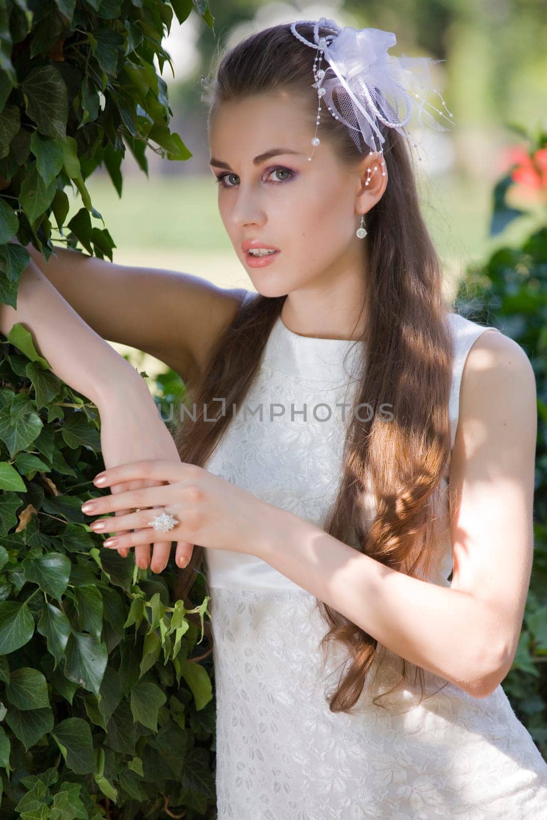 young bride waiting in park