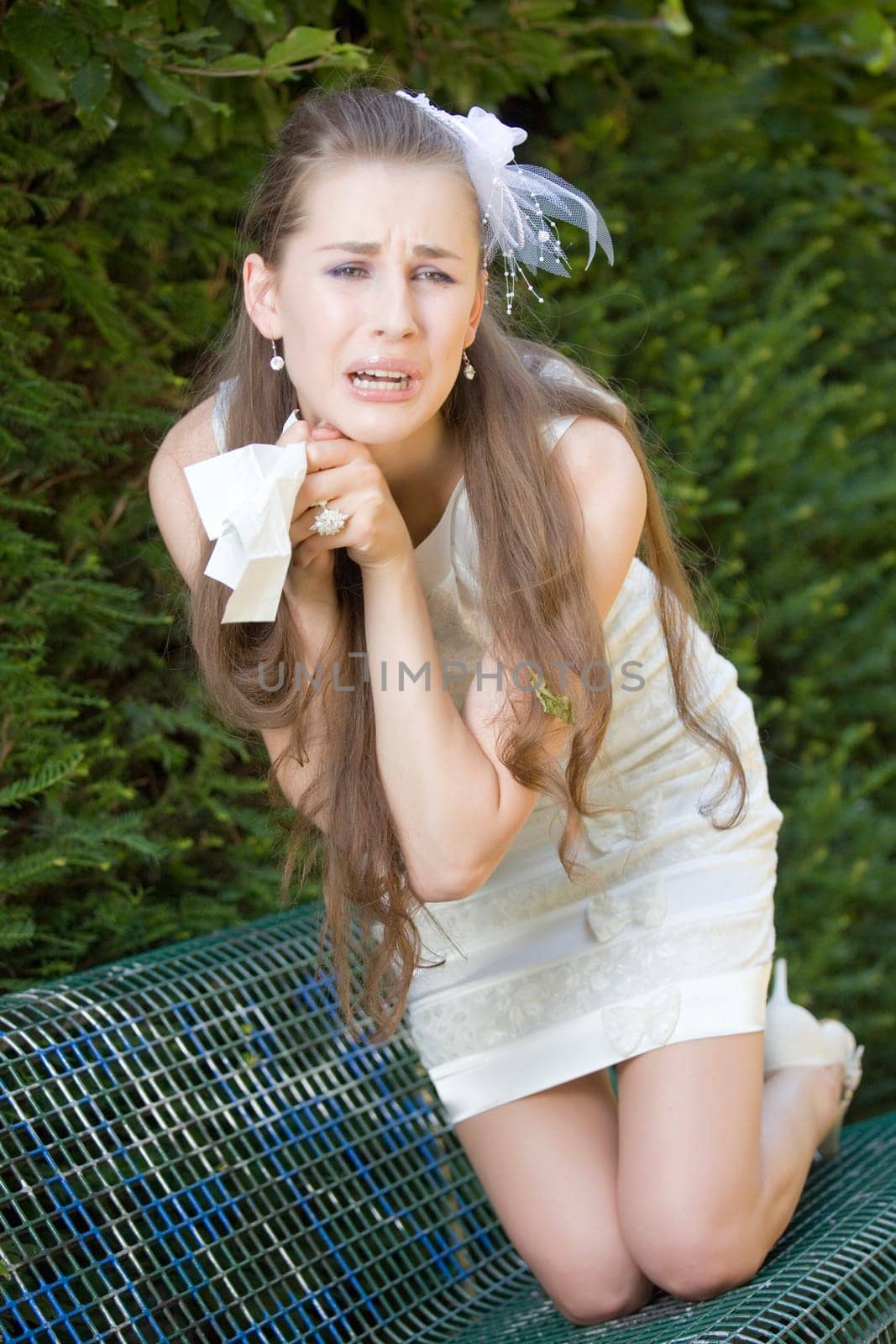 disappointed bride crying on bench