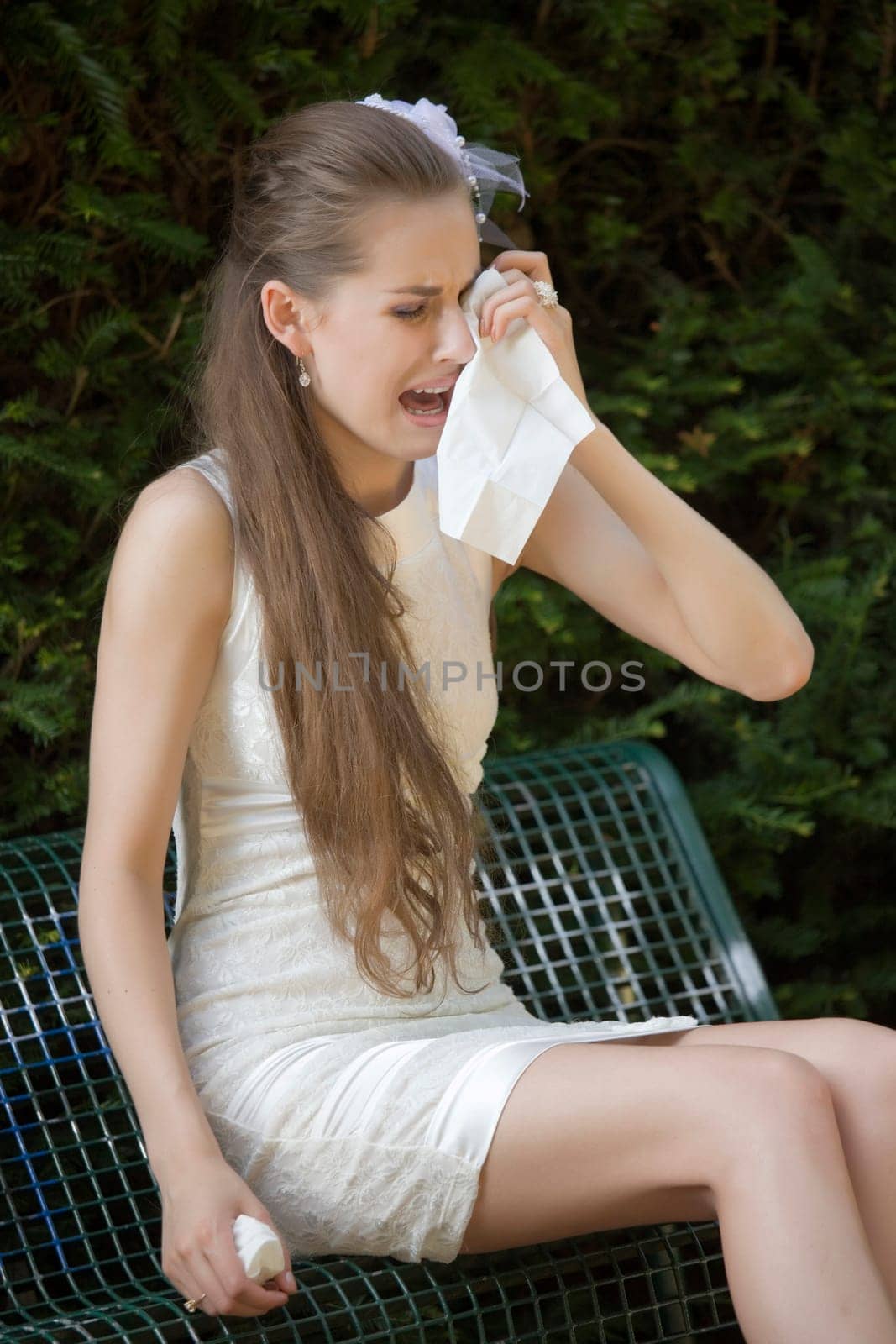 crying bride on bench