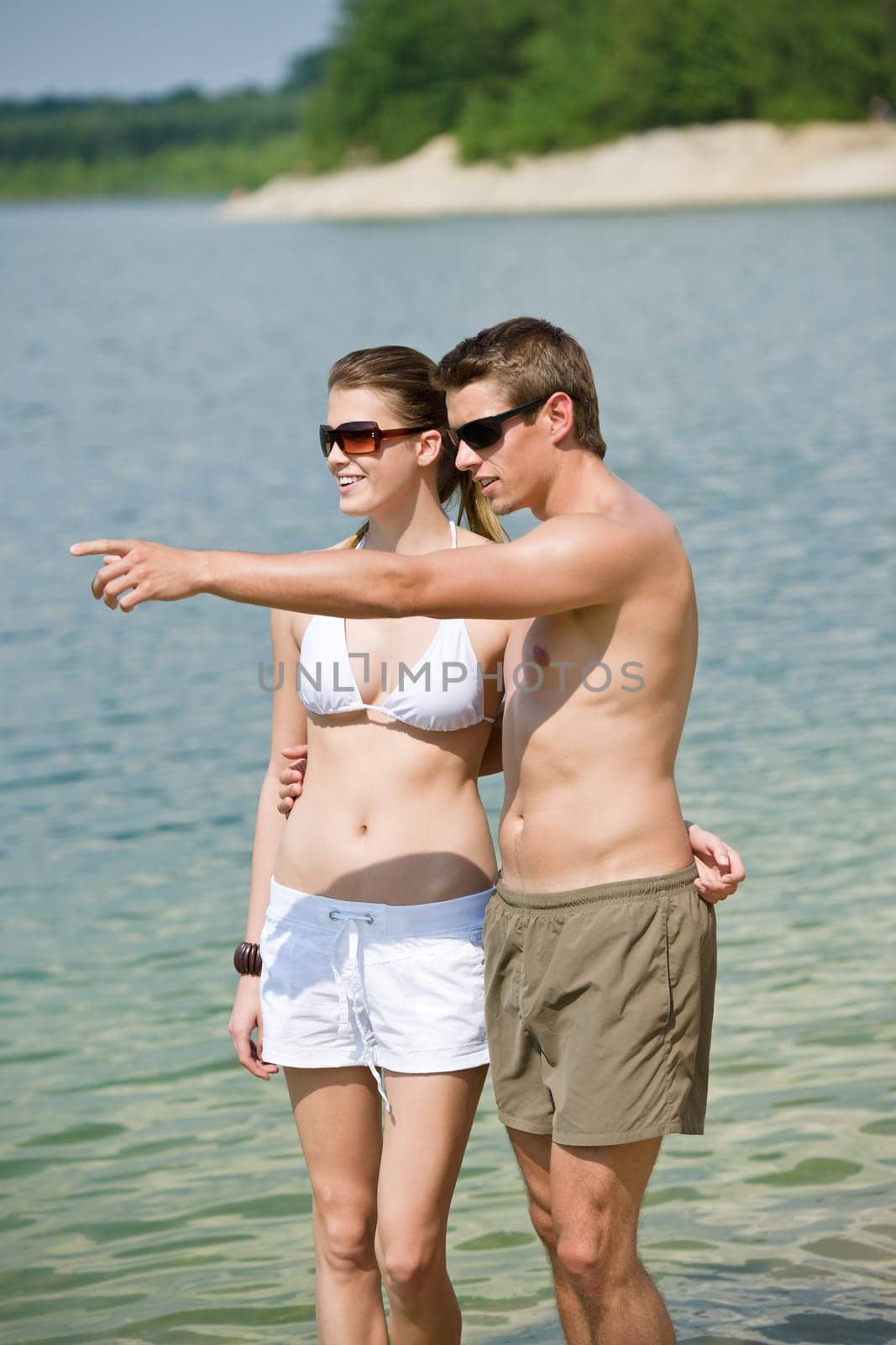 Couple enjoy sun at lake