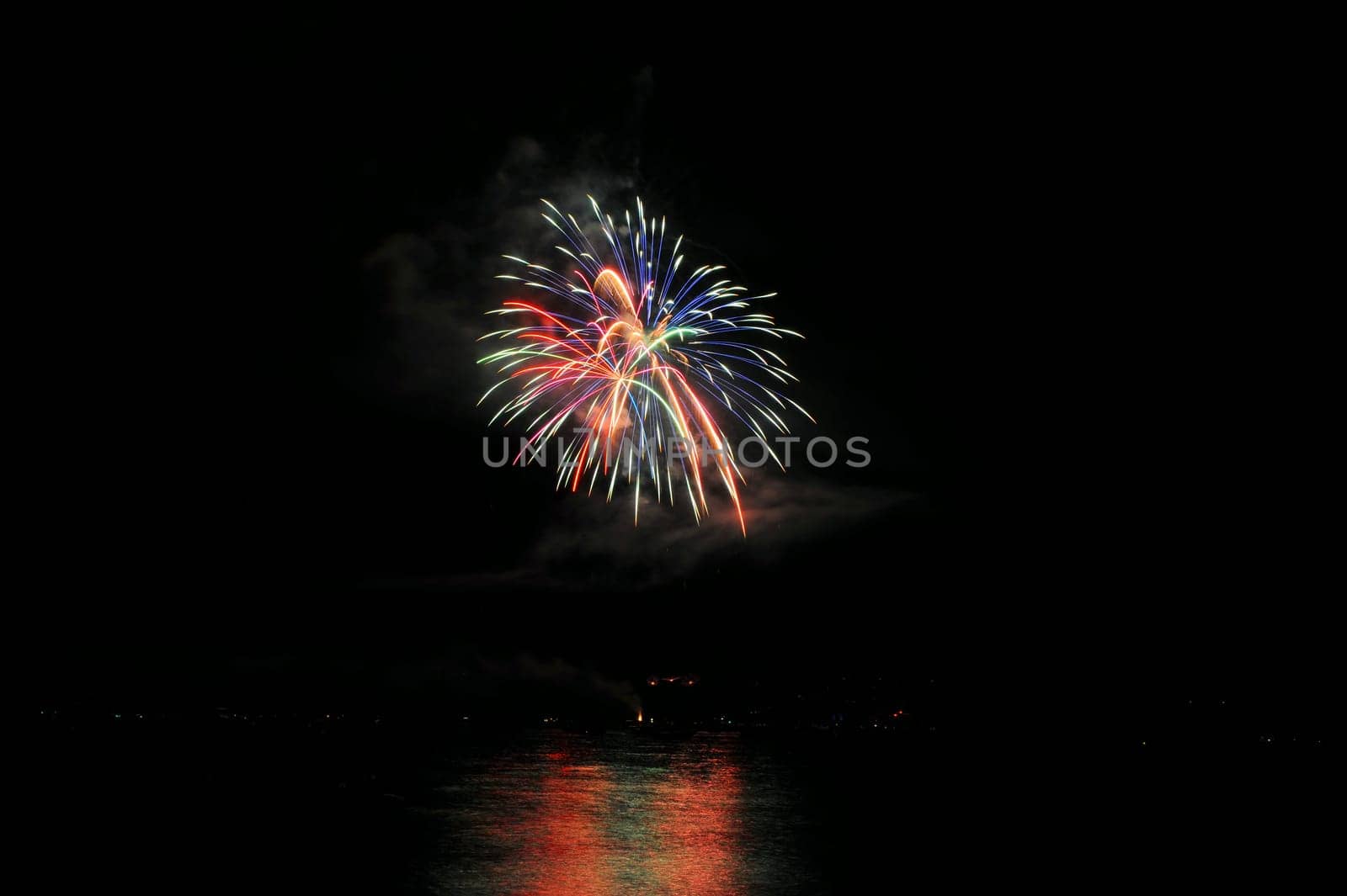 Fireworks And Reflected Colors
