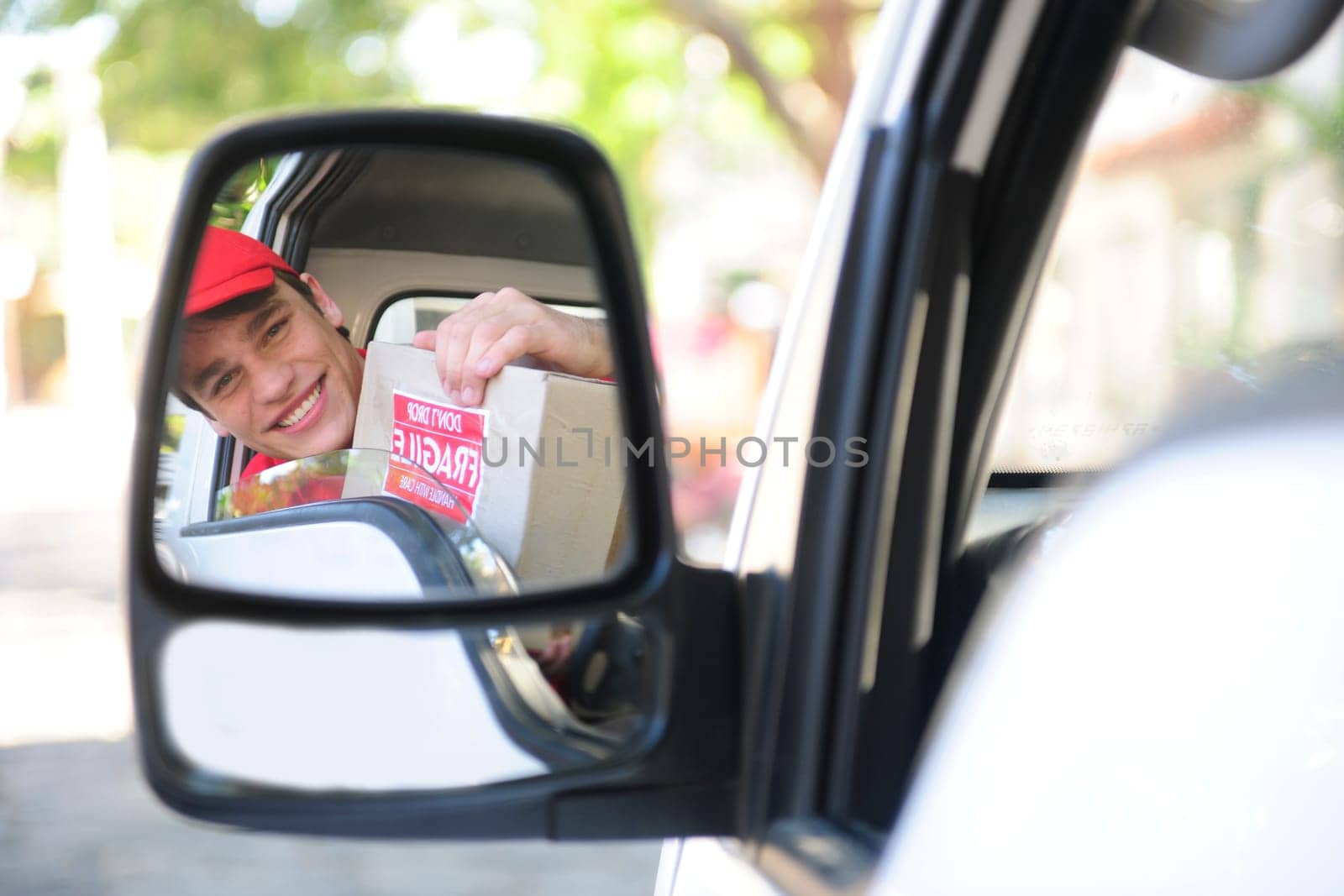 Parcel deliverer in van