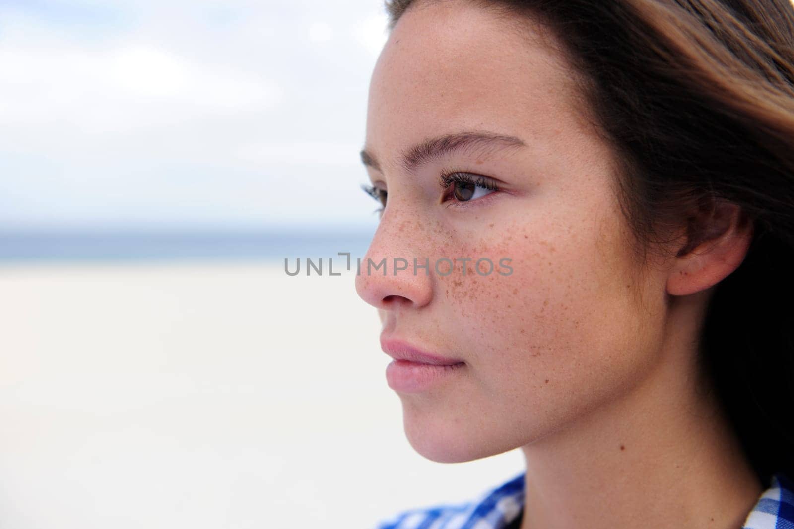 Portrait of a beautiful woman with freckles