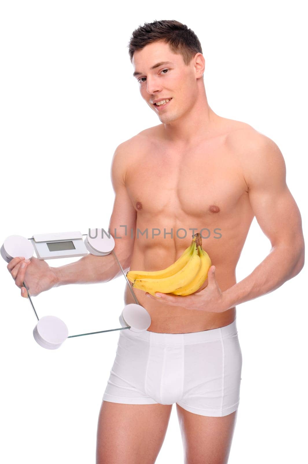 Young man with bathroom scales