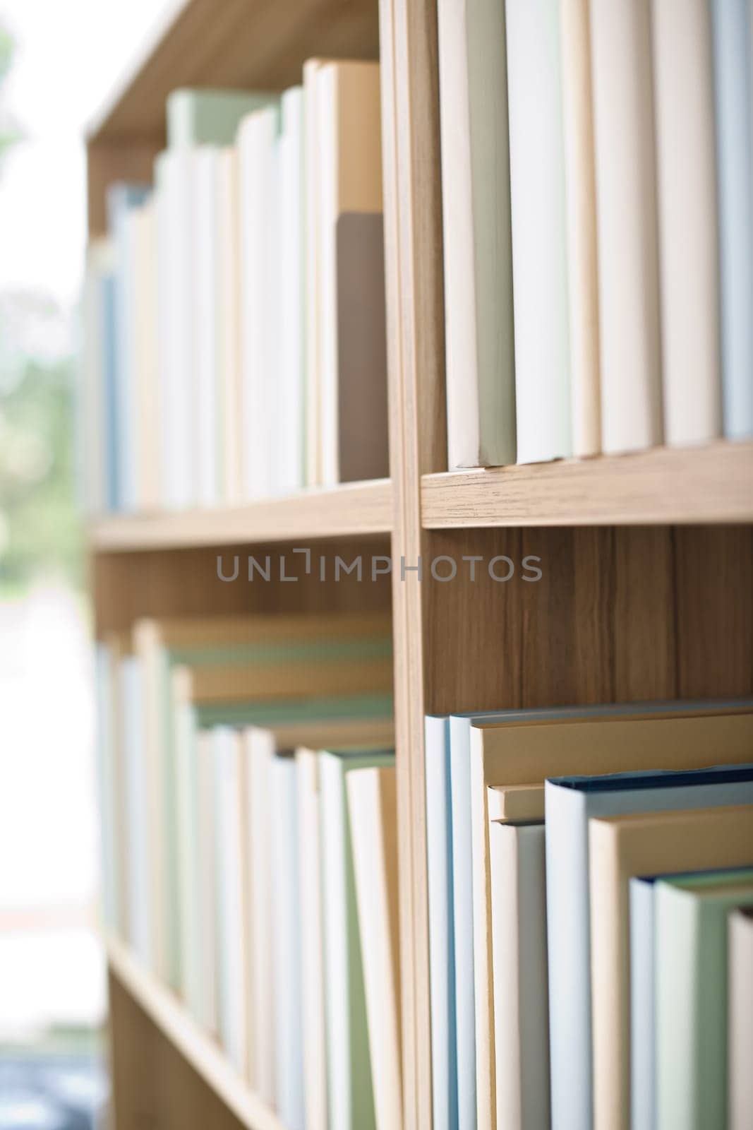 Library - row of books on bookshelf