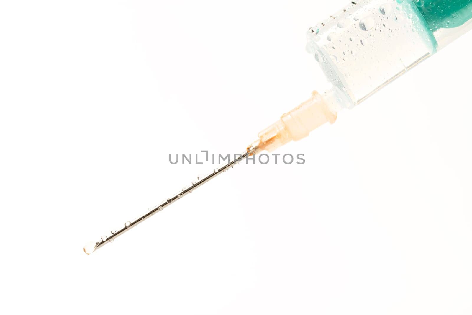 Wet syringe on white