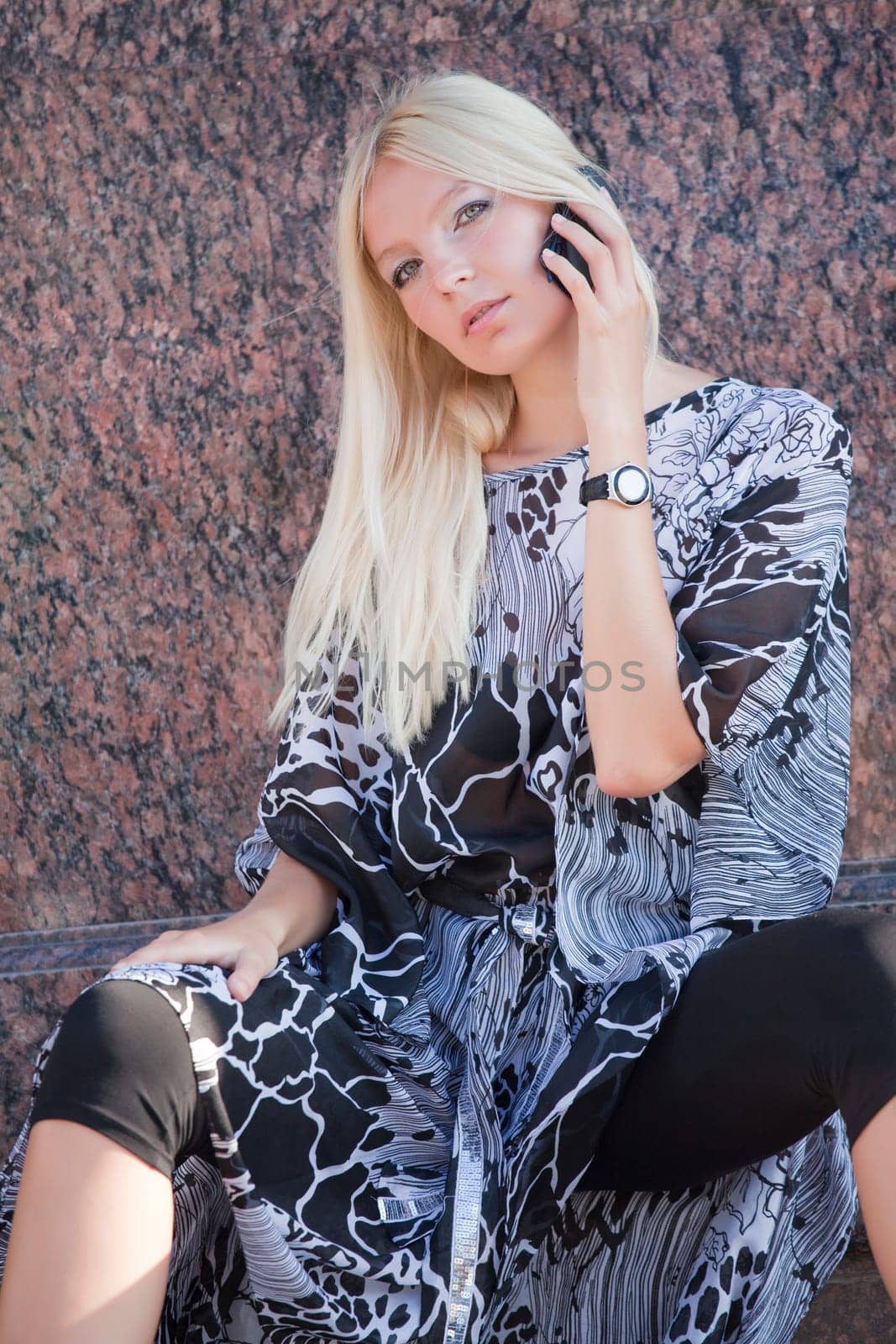 blond woman with cell phone