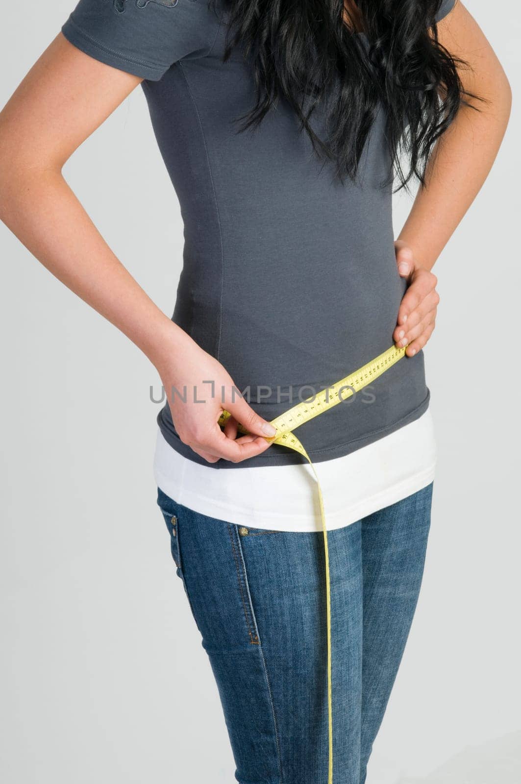 girl measuring her hip