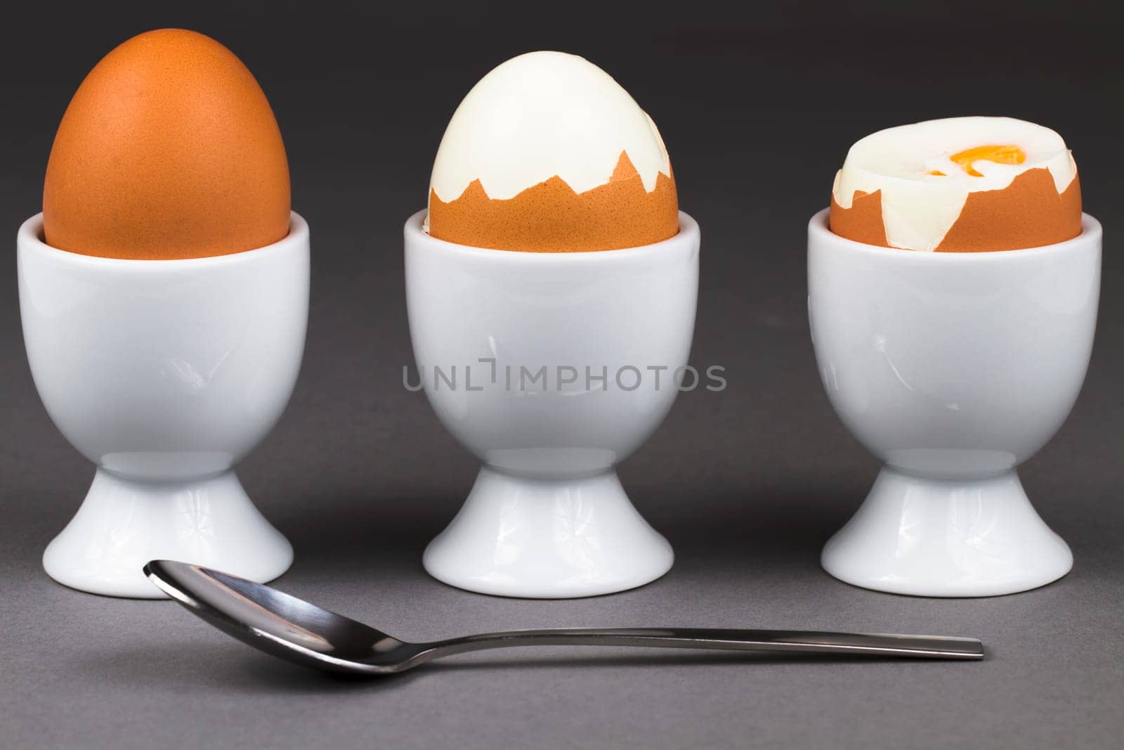 Three eggs with spoon