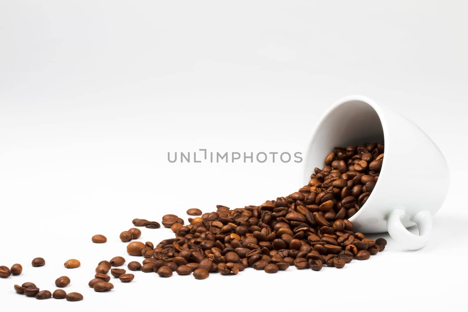 Coffee falls out of upturned cup