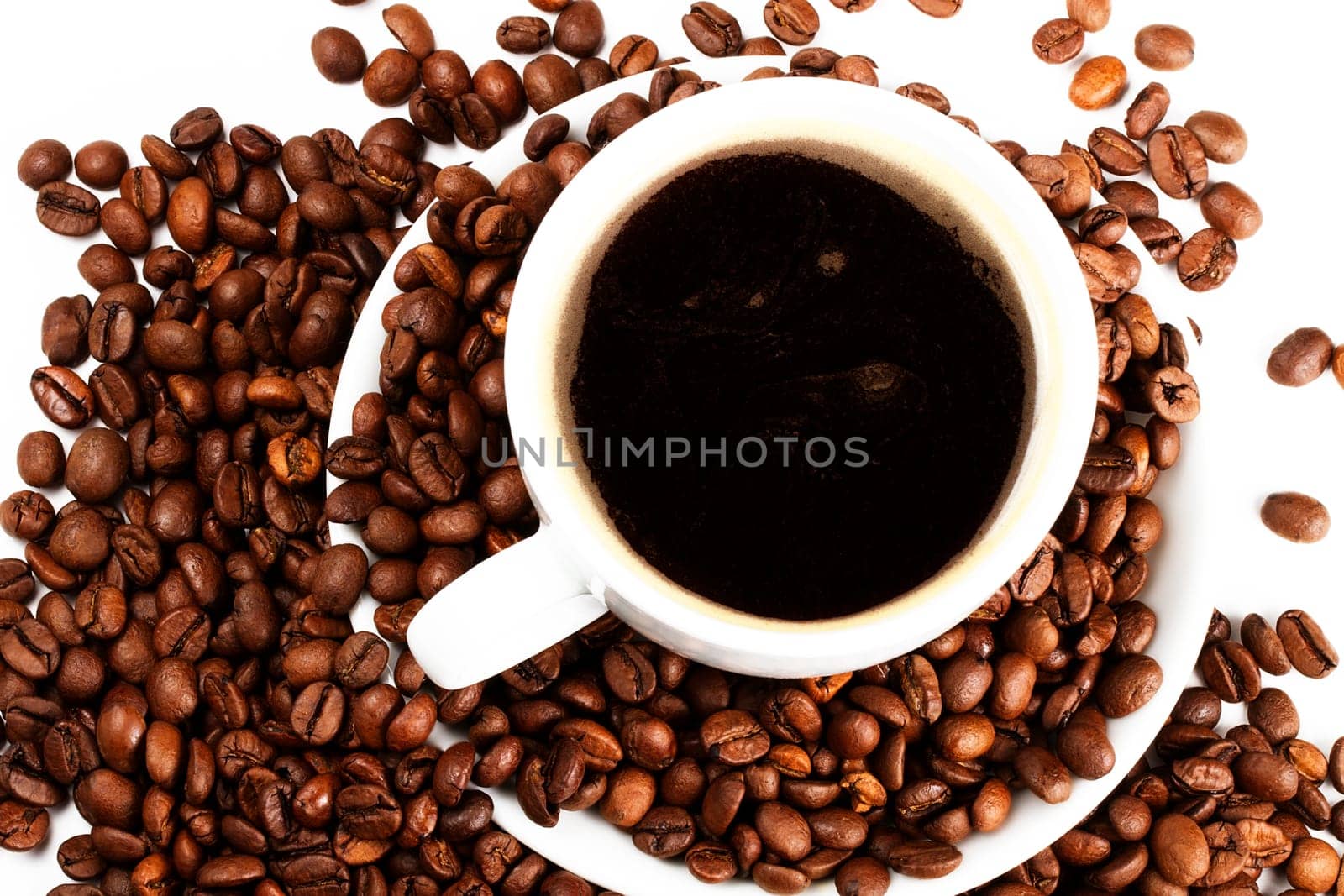Coffee cup with coffee beans from above
