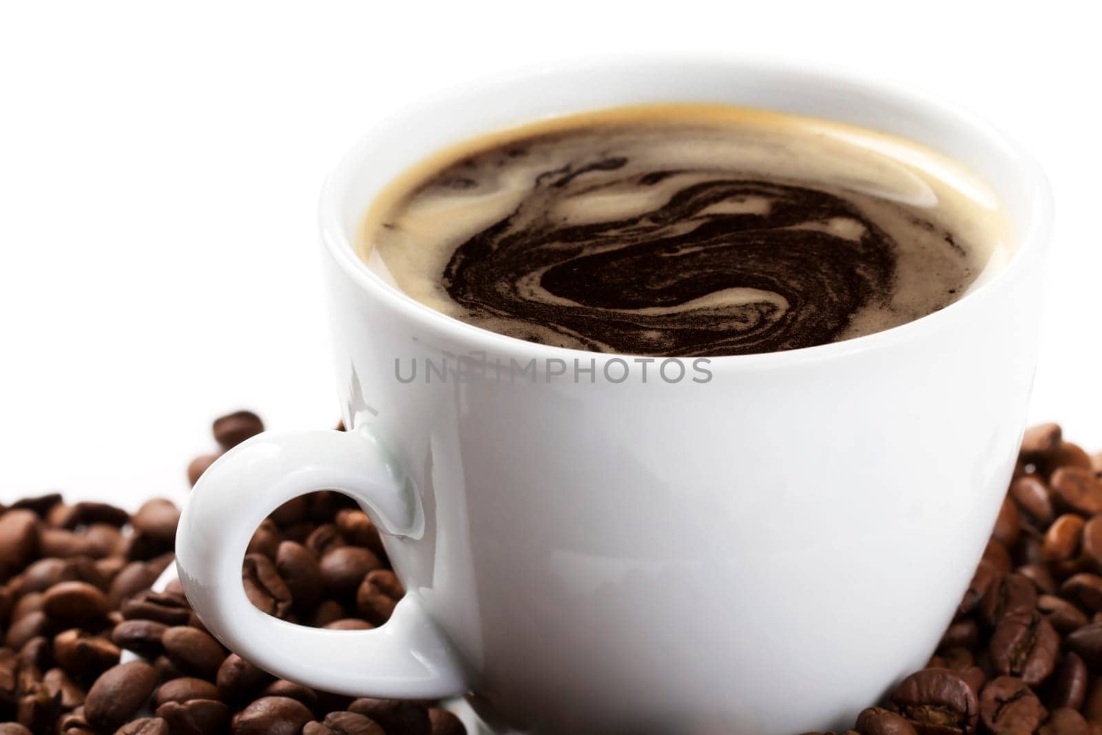 Coffee cup with coffee and beans oblique