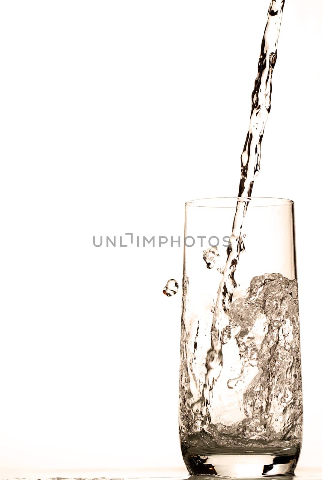 Water flows into glass