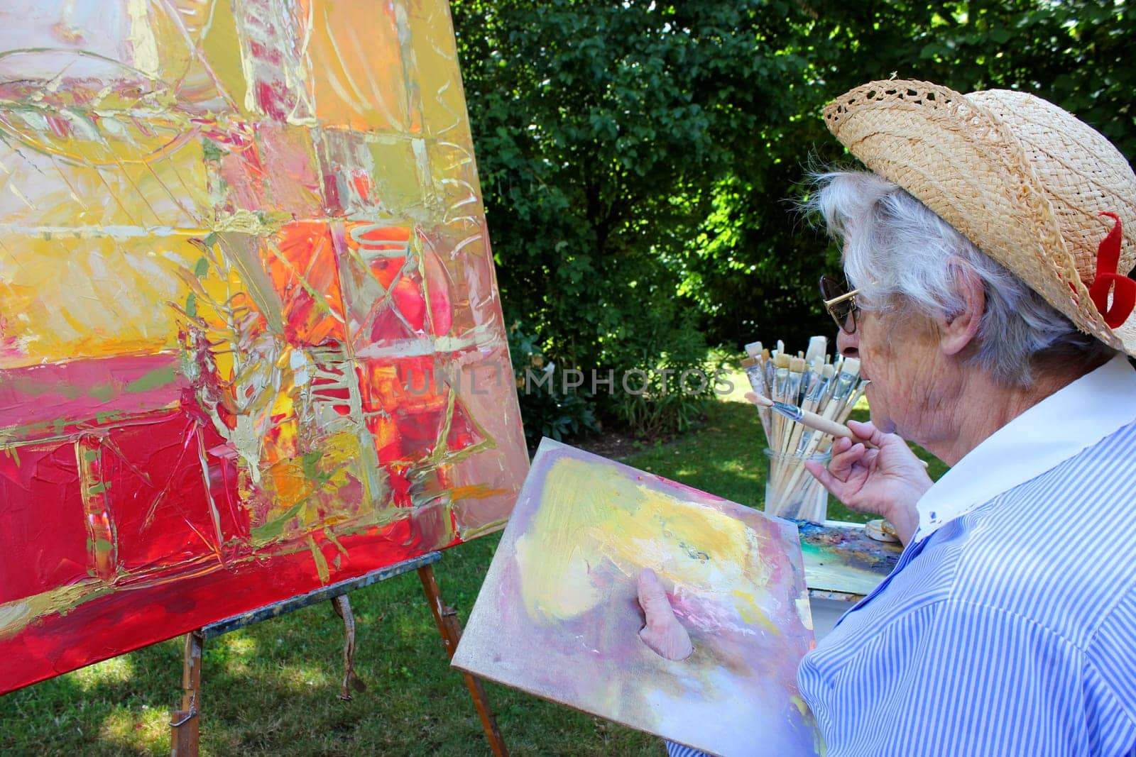 Senior woman painting