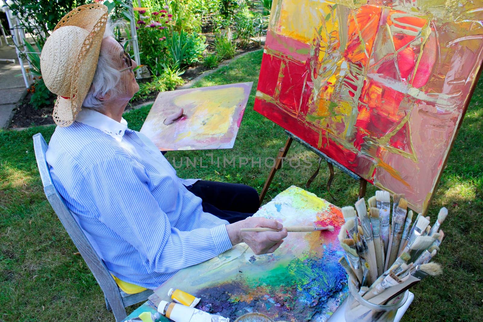 Senior woman painting