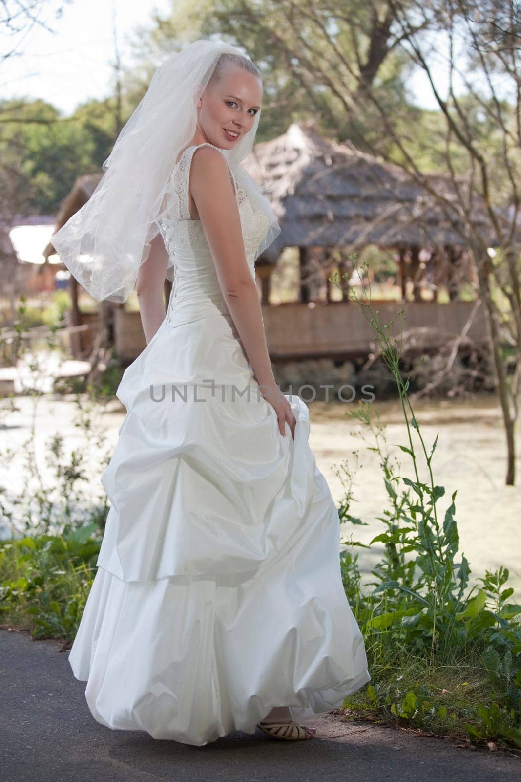 happy bride posing outdoor