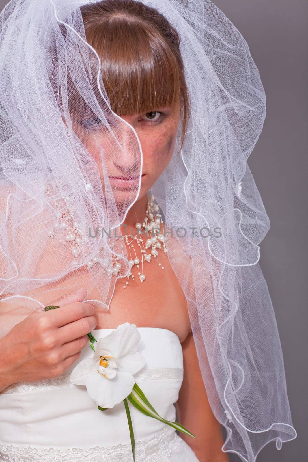crying bride under white veil