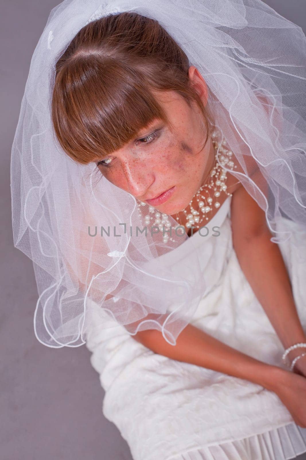 sad bride on the ground