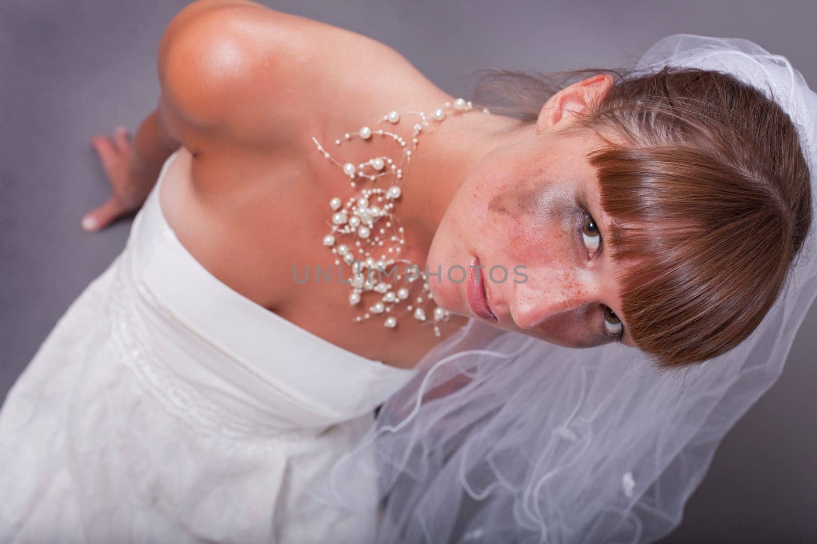 crying bride on the ground