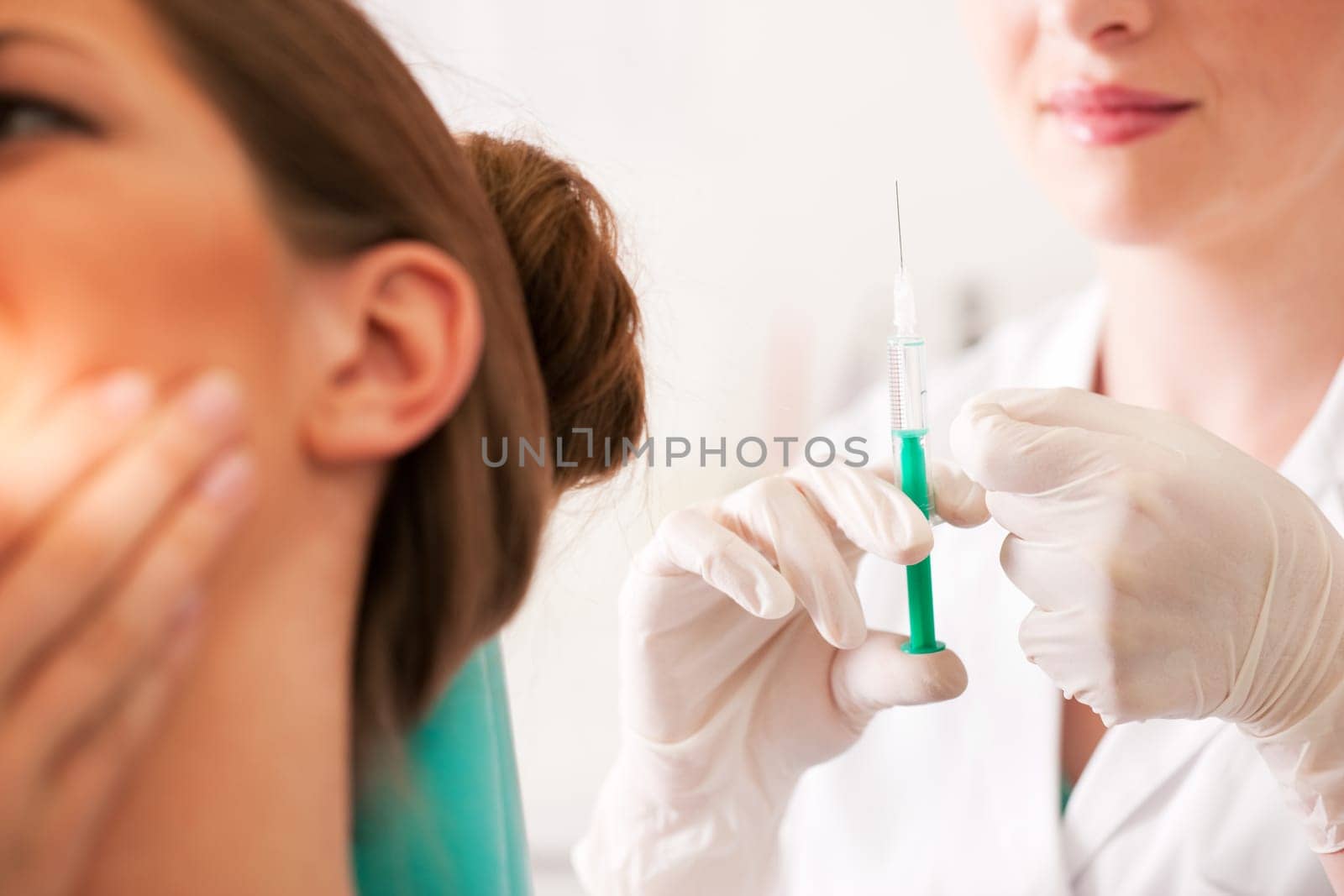 Patient at the dentist receives anesthesia