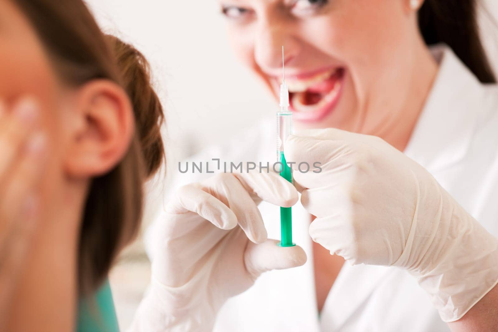 Patient at the dentist receives anesthesia