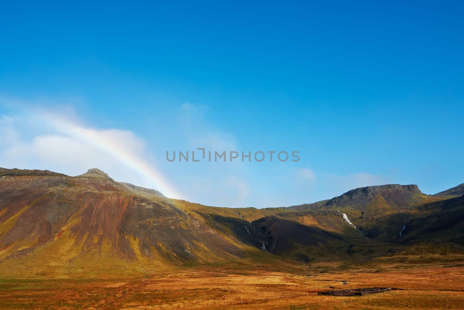 Beautiful rainbow over the mountains, North Fjords Iceland