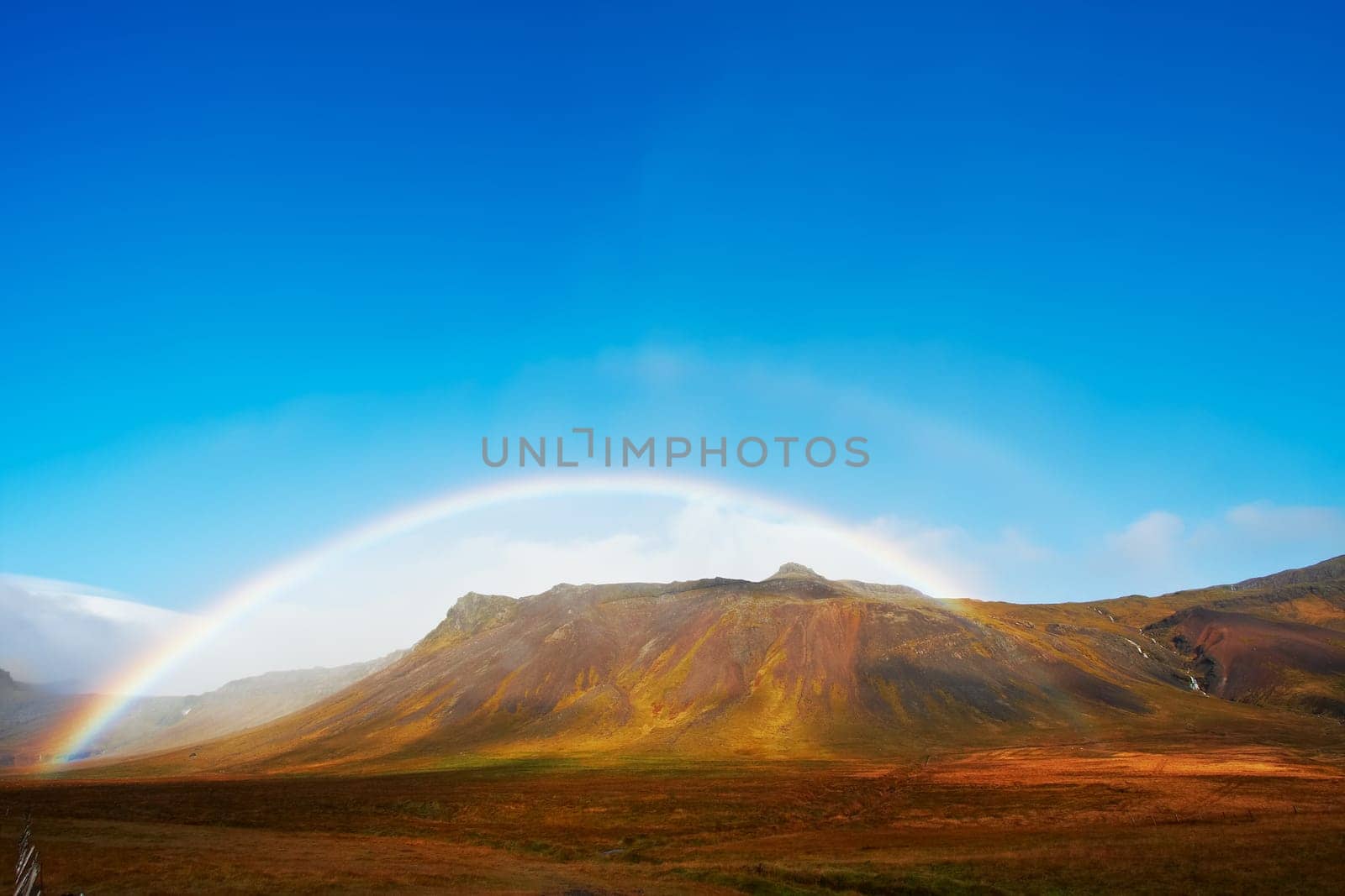Beautiful rainbow over the mountains, North Fjords Iceland