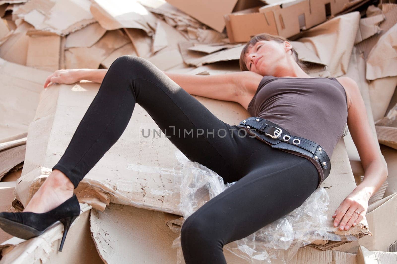 dead woman lying in cartons