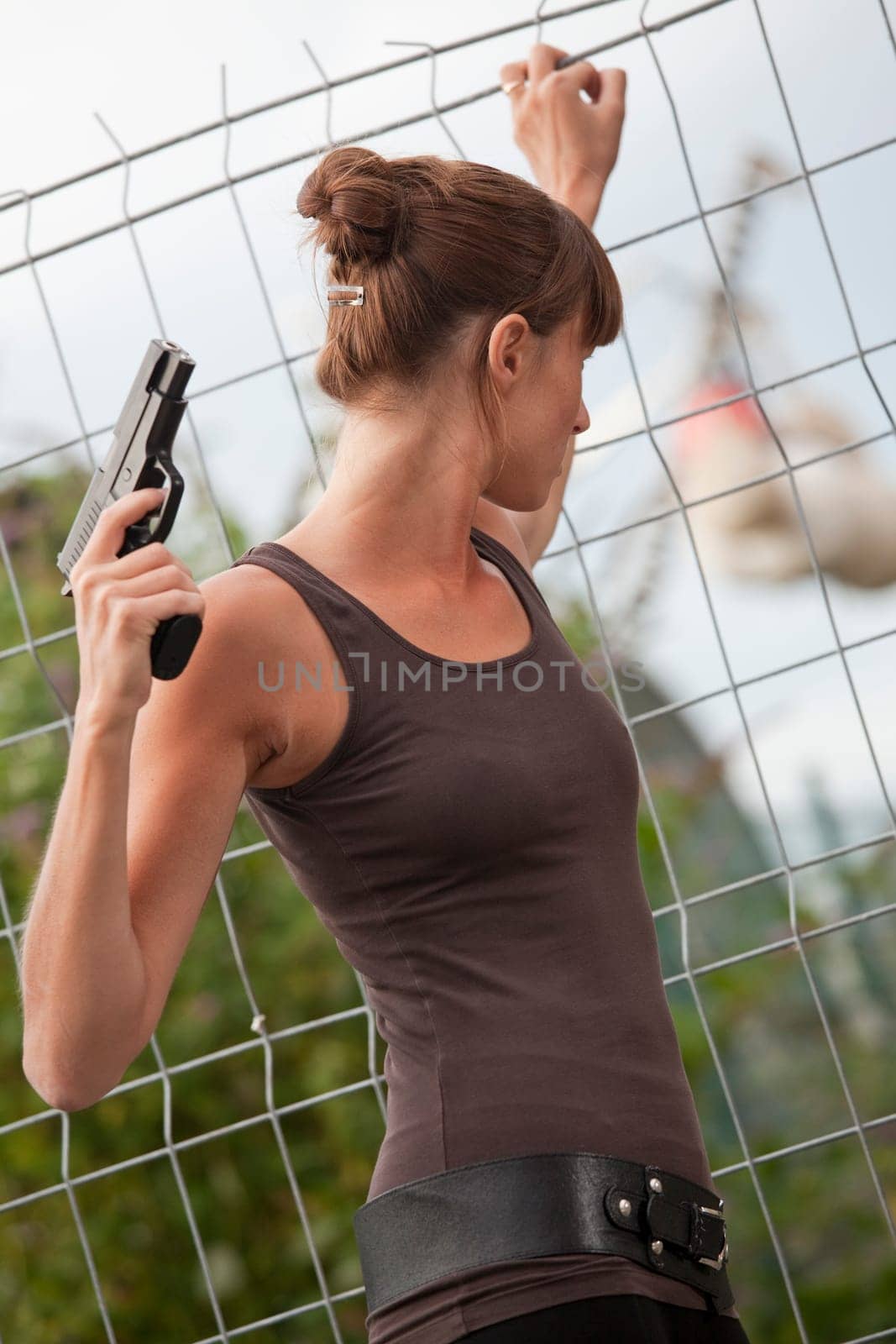 female agent with gun
