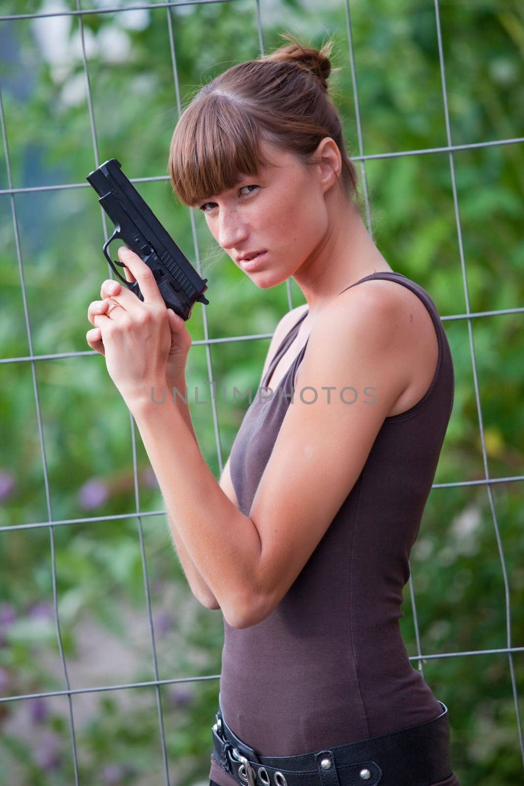 female agent with gun