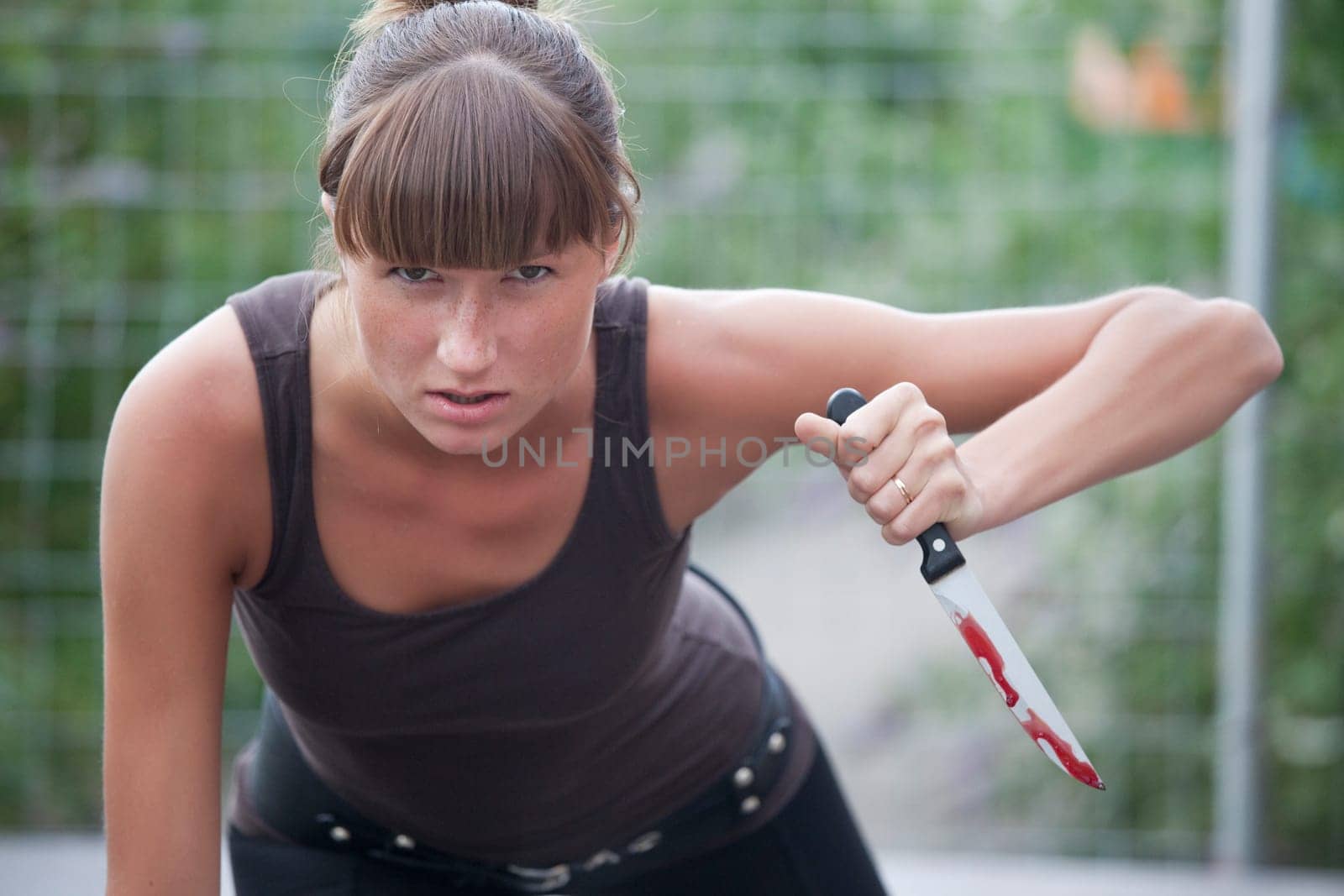angry woman with bloody knife