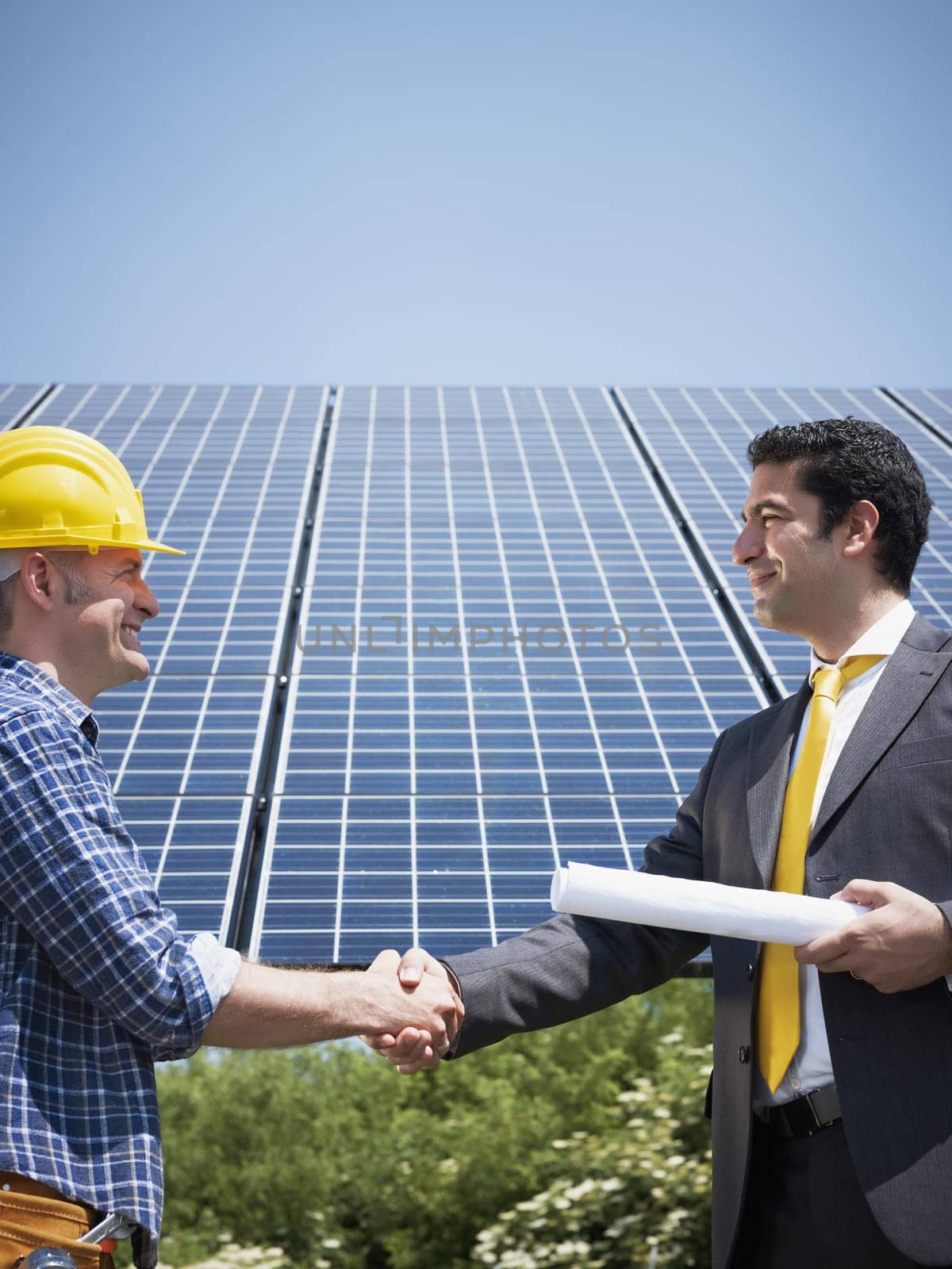 businessman and solar panels